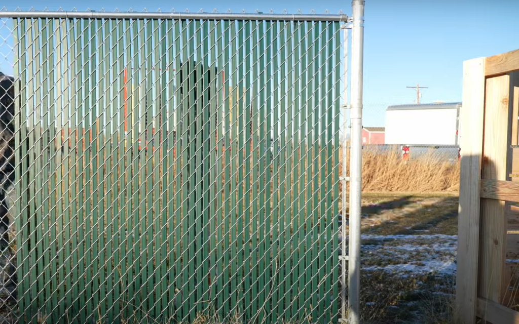 How can I make my old chain link fence look better?