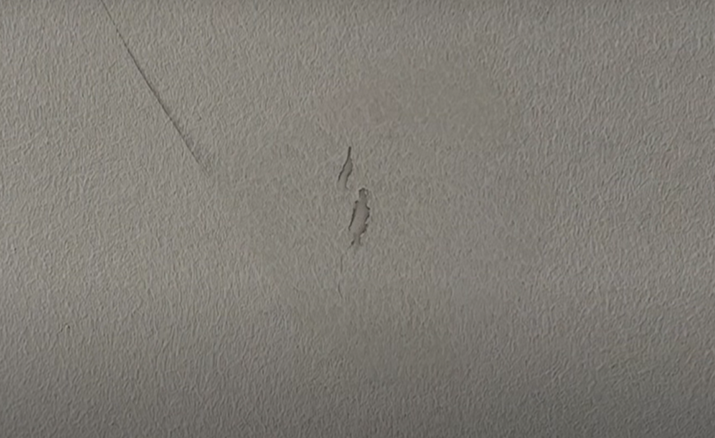 How do you fix wall imperfections after painting?